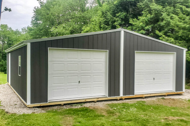 Angled view of the 28x32 shed highlighting the dual garage doors