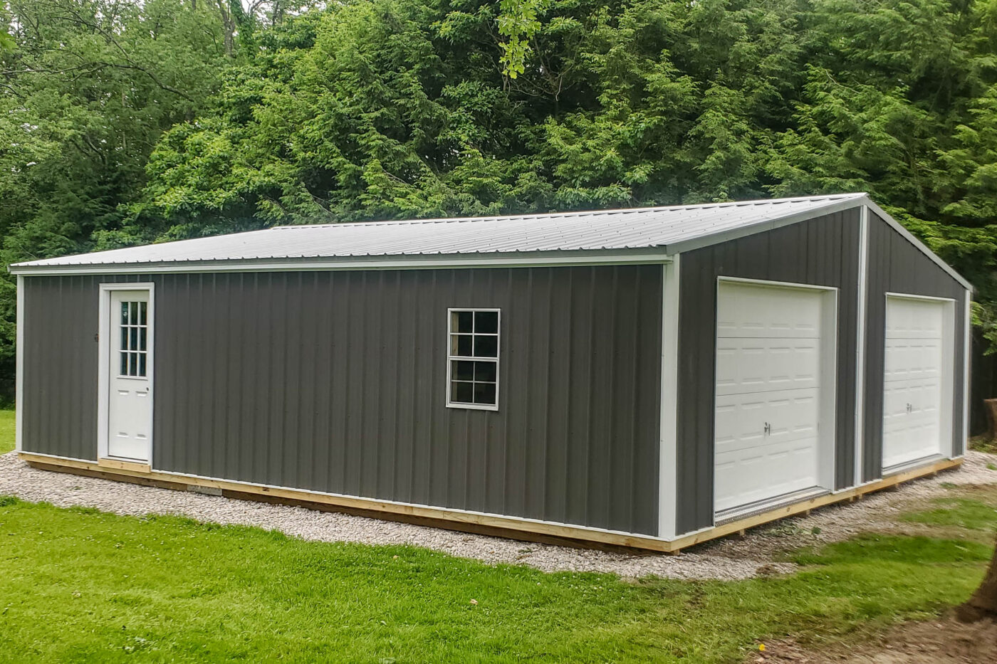 Side view of 28x32 Shed Featuring Walk-in Door and Single Window