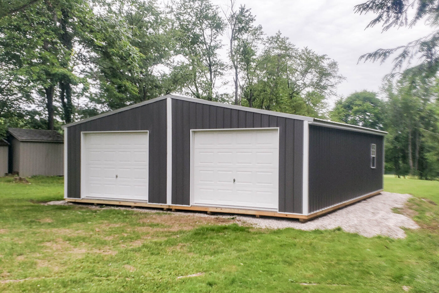 Front View of 28x32 Shed with Dual White Garage Doors