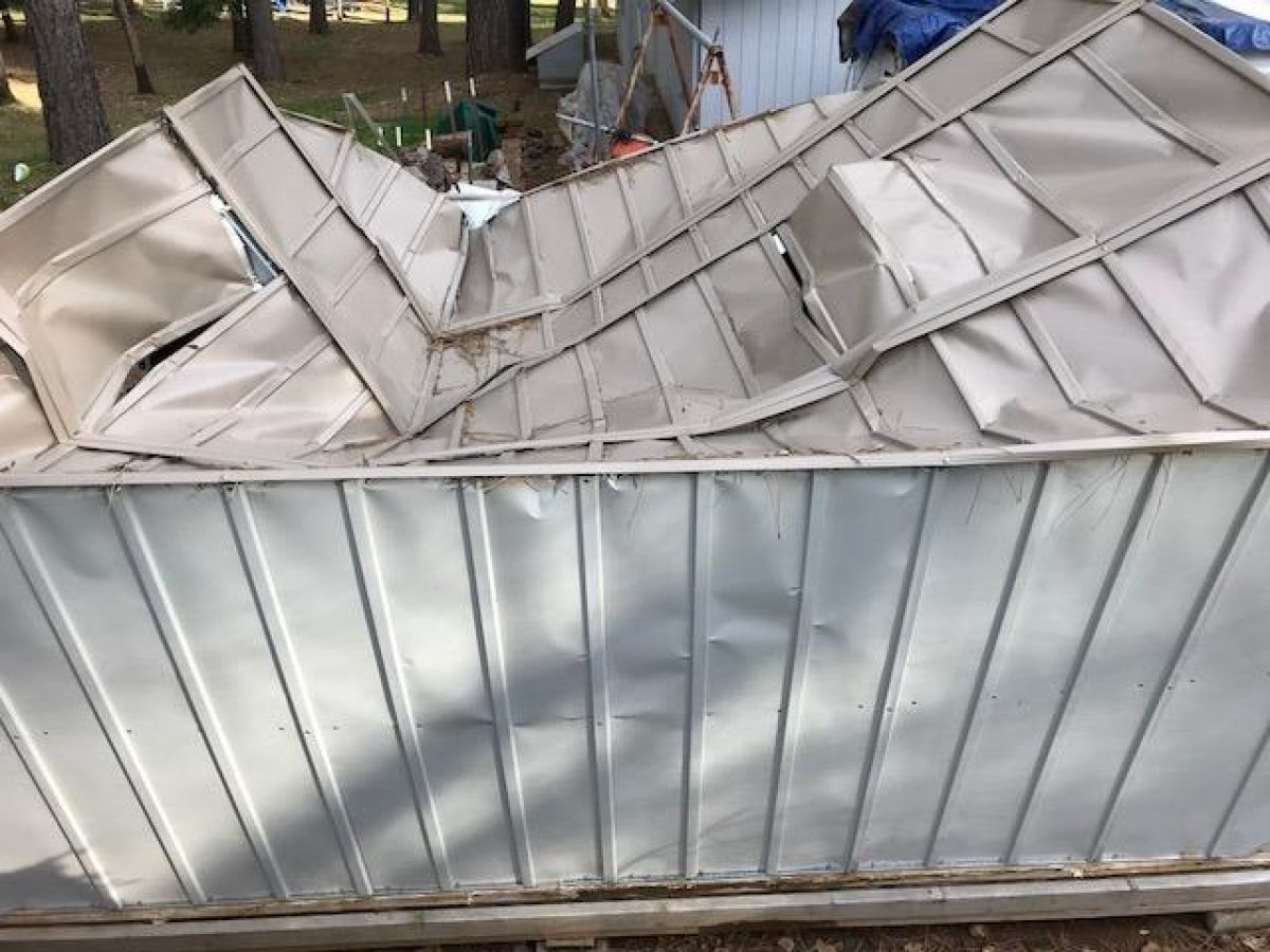 collapsed metal shed 
