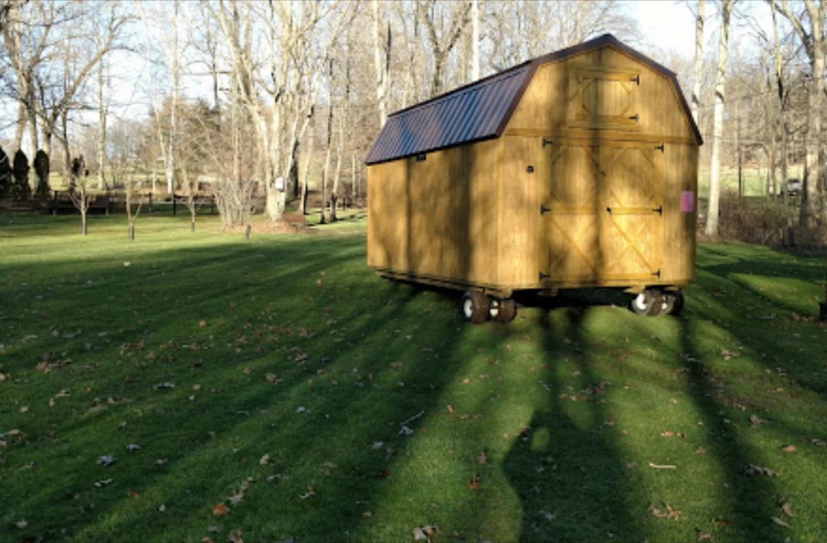wooden storage building delivery in yard