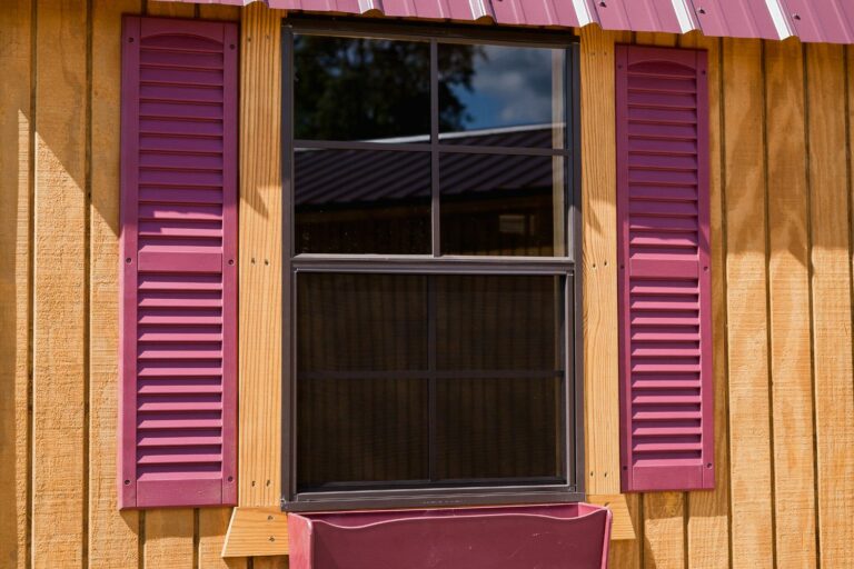 lofted barn cabin window with shutters