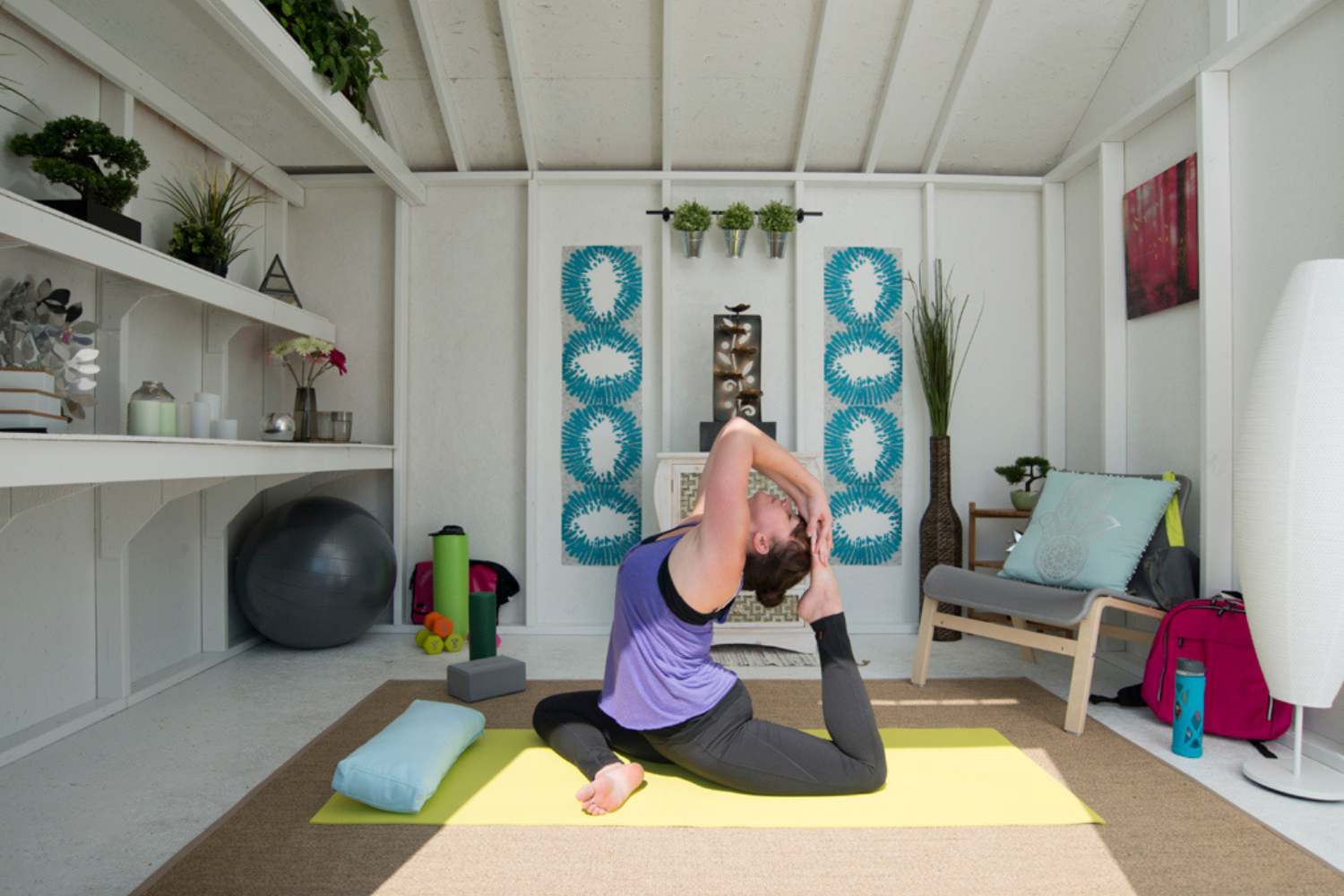 Gym studio shed with yoga mat and yogi