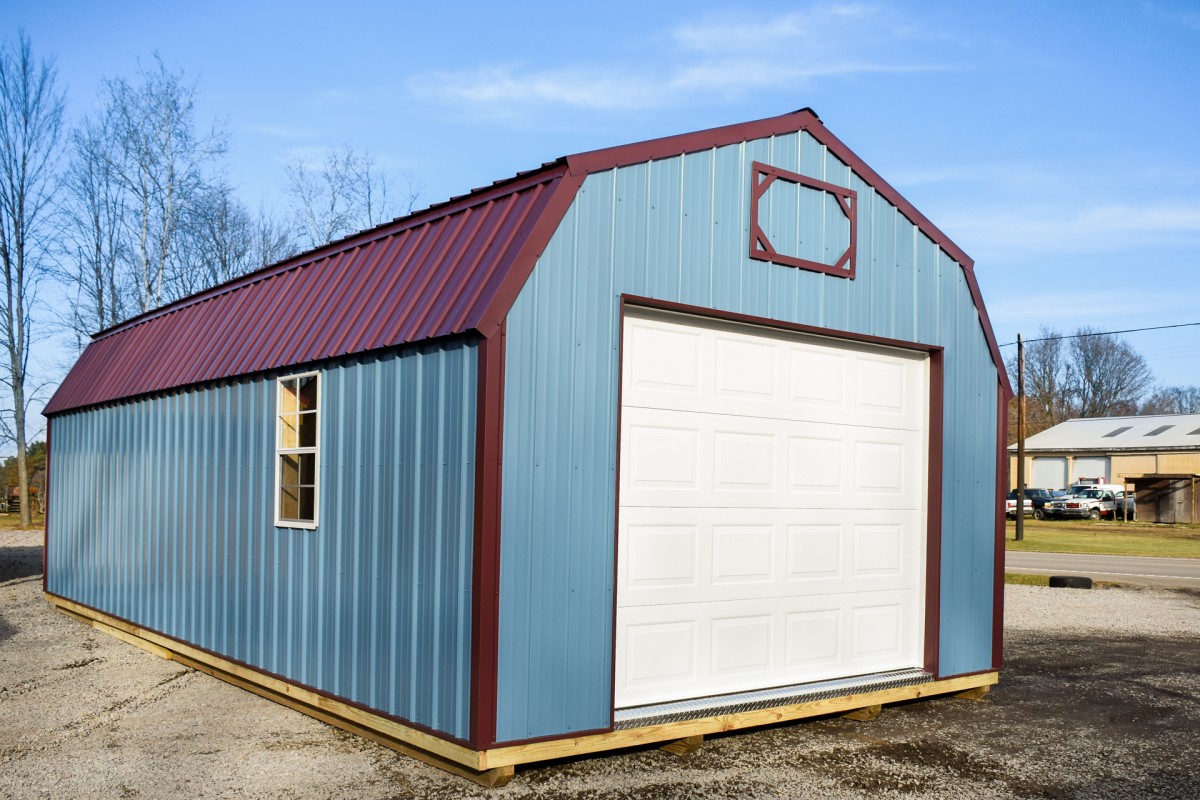 Teal portable garage in shed lot