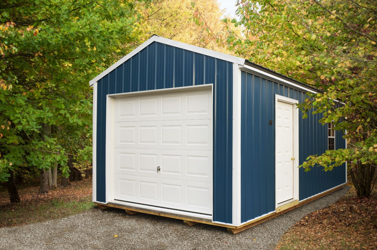 Blue portable garage in woods