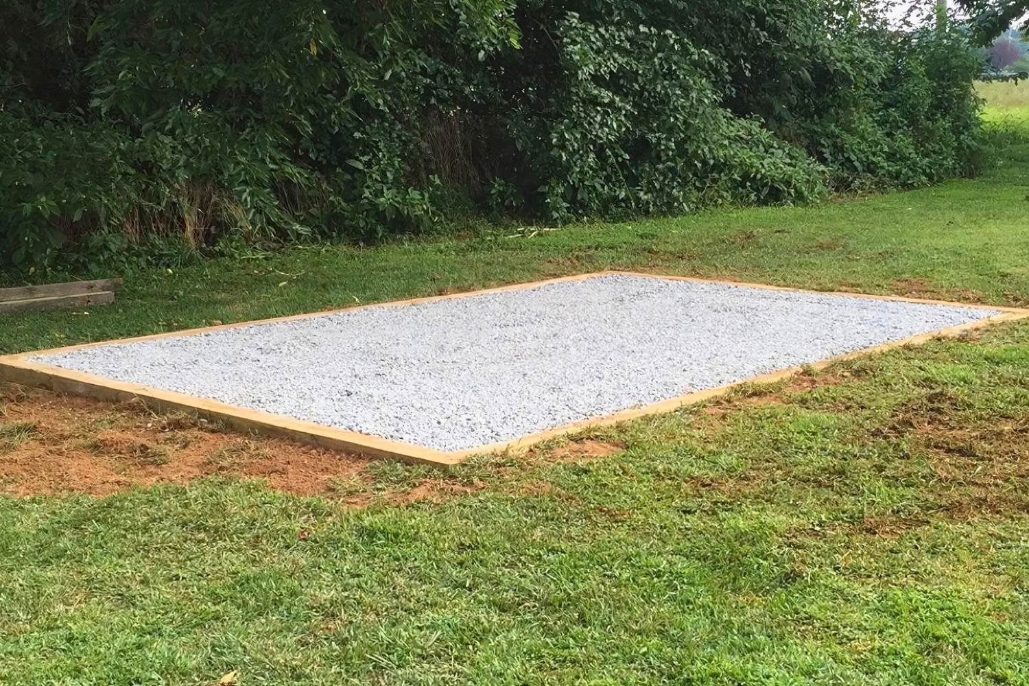 Shed pad gravel site for wooden shed